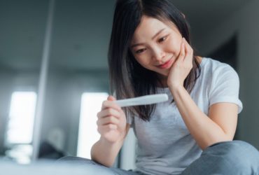 Woman happy with pregnancy test result Oscar Wong Getty 920x581 1